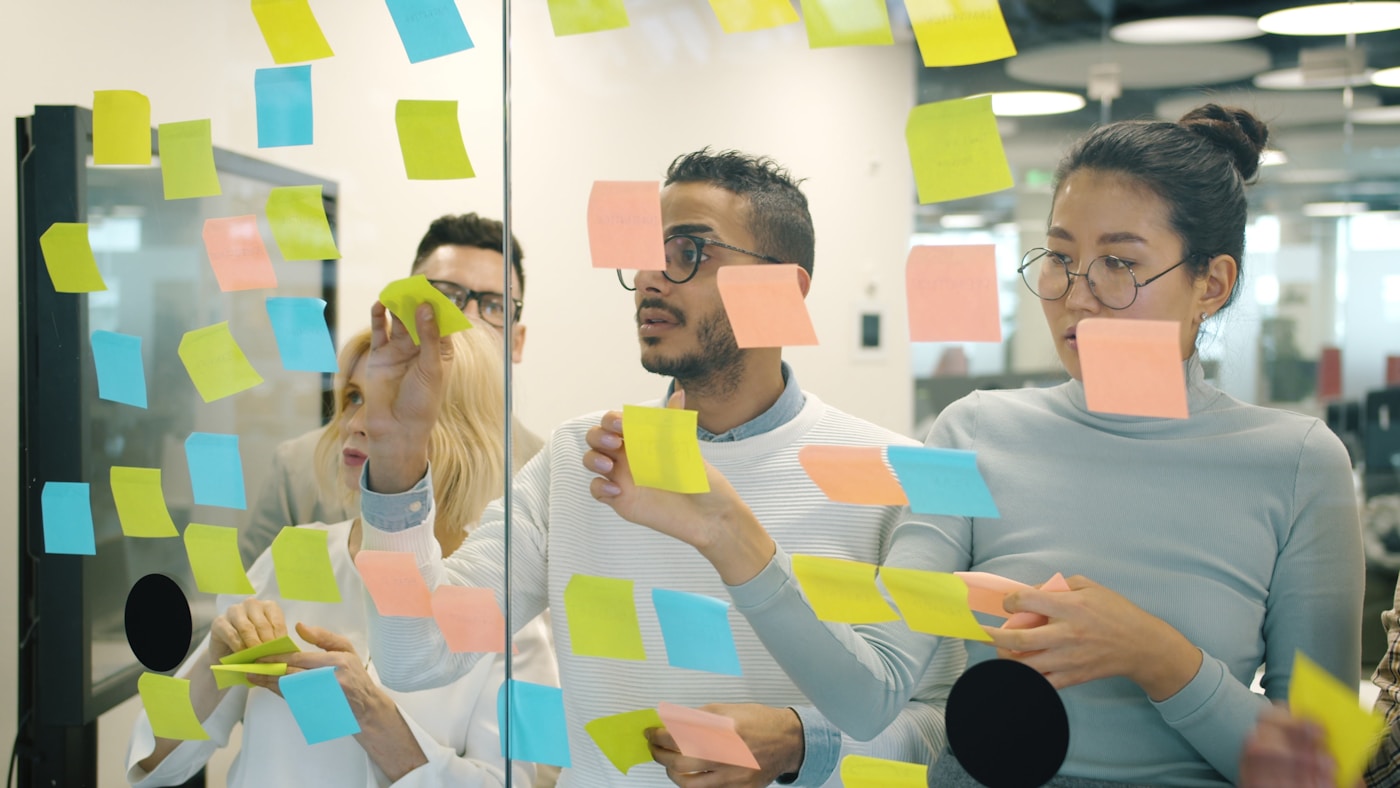 Team workshop brainstorming with sticky notes